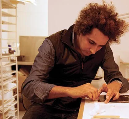 Christian Russell working on a paper repair
