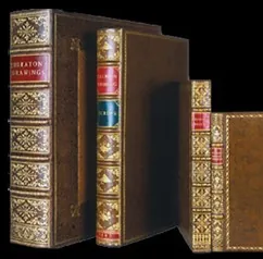 Restored leather-bound books with gilt spines