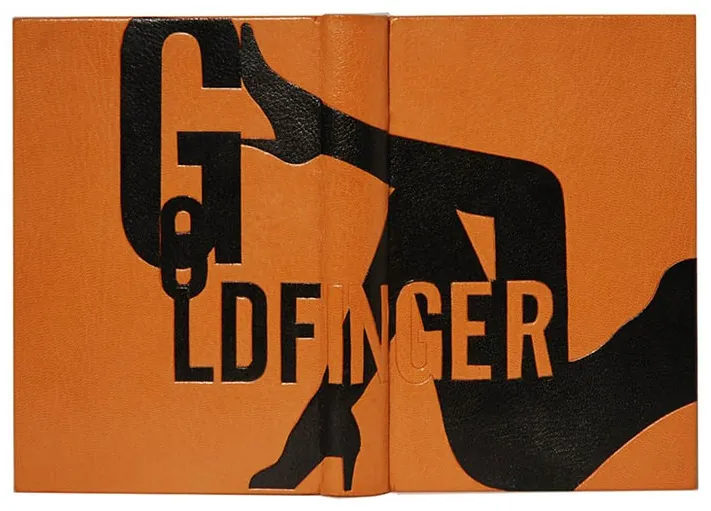 Goldfinger bound in orange with black lettering and a silhouette