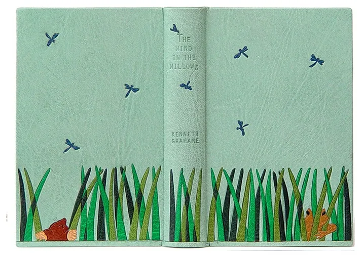 The Wind in the Willows bound in duck egg blue goatskin with leather onlays of grass, Mole and Toad