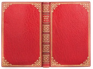 A book bound in red full leather with gilt corner tools and a gilt spine